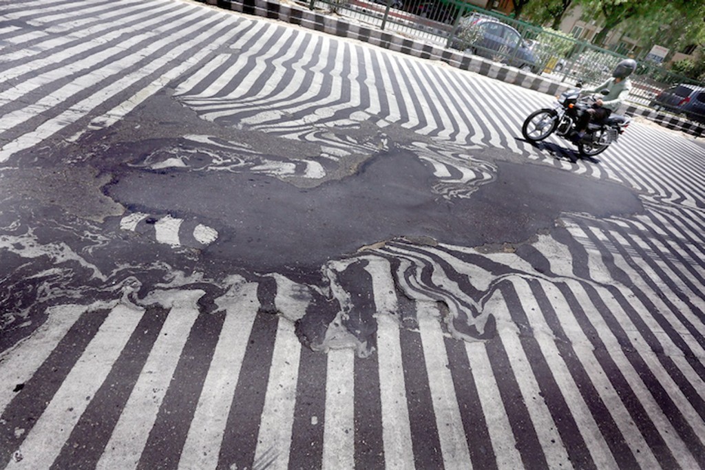 Asphalt was literally melting away on New Delhi roads  due to high temperatures this week. (Source: Rappler)