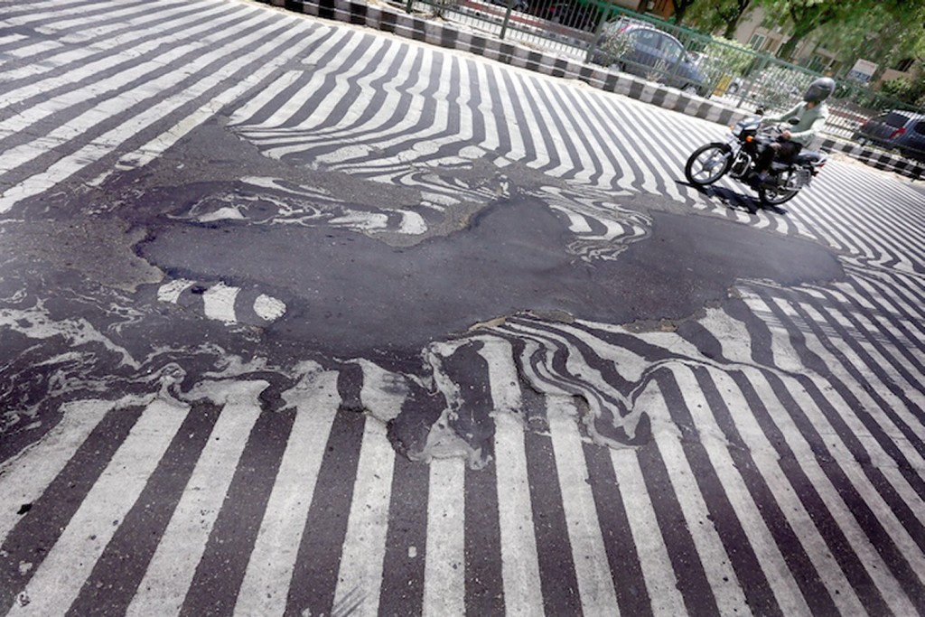 Asphalt was literally melting away on New Delhi roads due to high temperatures this week. (Source: Rappler)