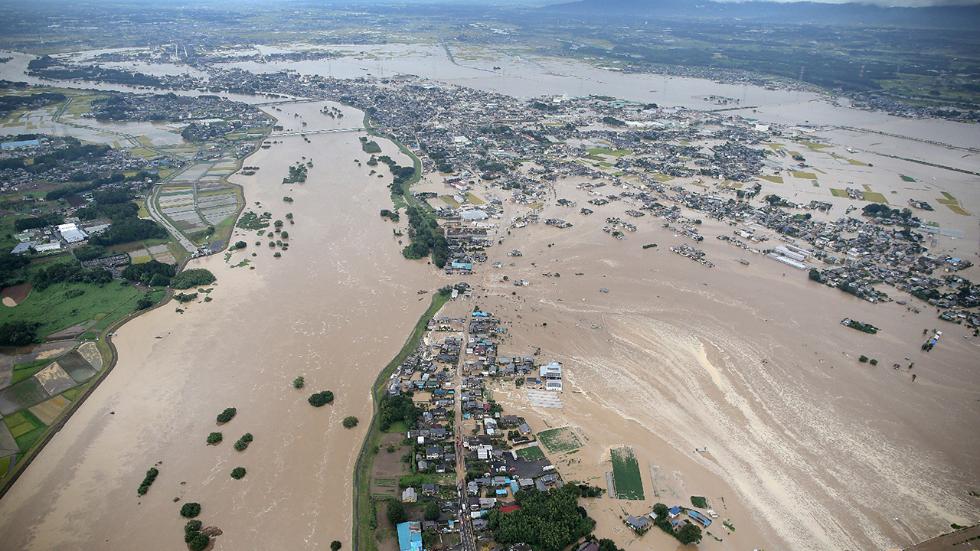 Levees of the Kinugawa River breached in Joso from the heavy rains. (Source: AFP/via TWC)