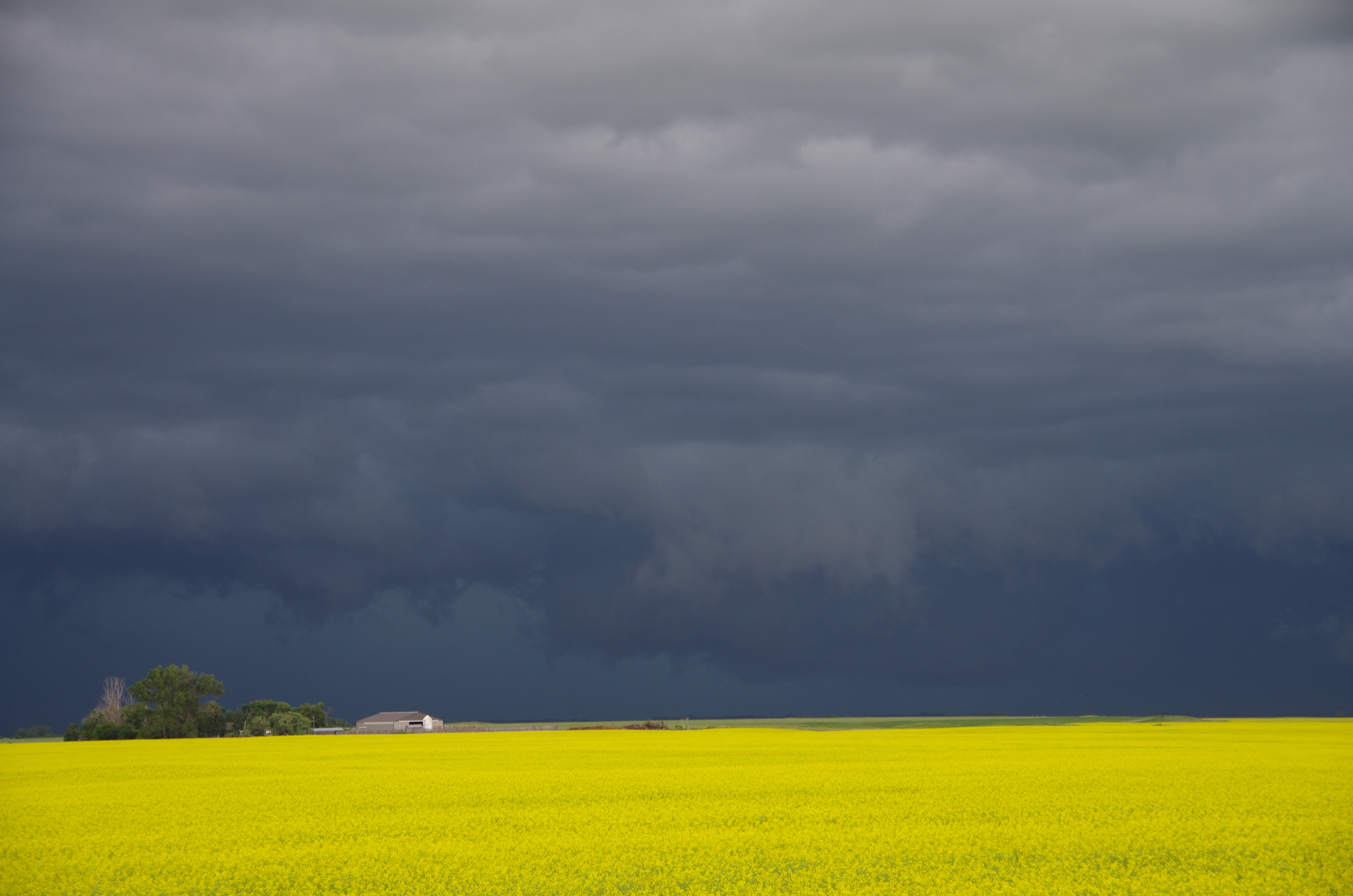A few rotating wall clouds were observed as the supercell dove southeasterly, northwest of Killarney.